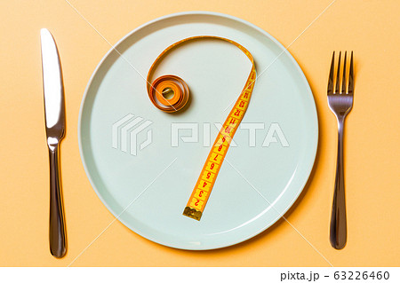 Question mark made of measuring tape on round Question mark made of measuring tape on round 63226460