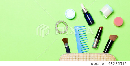 Aerial view of a leather cosmetics bag with make 63226512