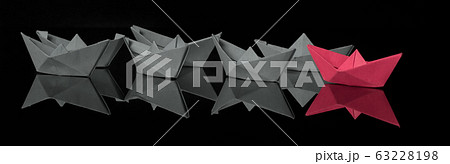 Leadership concept with red paper ship leading 63228198