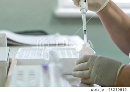 Laboratory equipment for blood analysis. The real work of the laboratory assistant in the hospital. 63230616