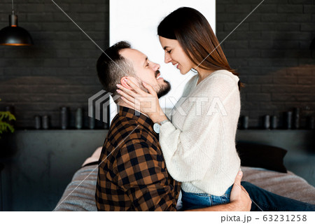 love story at bedroom. Couple in love on bed love story at bedroom. Couple in love on bed 63231258