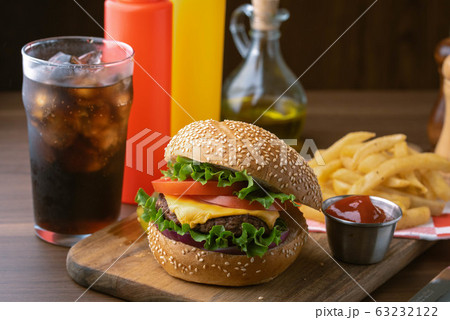 cheese burger with cola and french fries 63232122