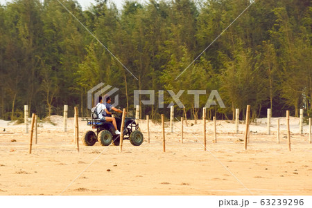 Honeymoon couple riding Motorized tricycle  63239296