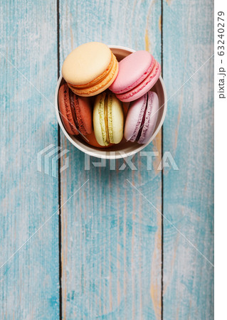 Macaroni cookies are placed in a white plate on a 63240279