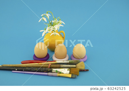 Easter egg decoration concept with paint brushes 63242525