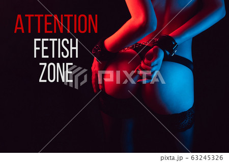 Attention, fetish zone. sexy ass girl with hands in handcuffs 63245326