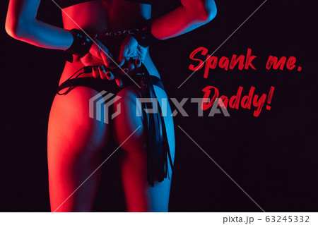 Sexy ass girl in a Thong with a leather whip for spanking 63245332