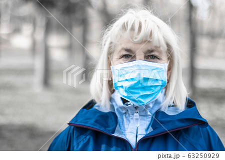 COVID-19 Pandemic Coronavirus woman wearing face mask protective for spreading of Coronavirus Disease 2019 in city street. COVID-19 Pandemic Coronavirus woman wearing face mask protective for spreading of Coronavirus Disease 2019 in city street. 63250929