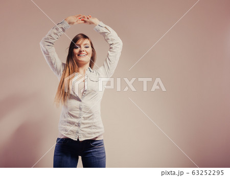 fashionable woman in shirt denim pants 63252295