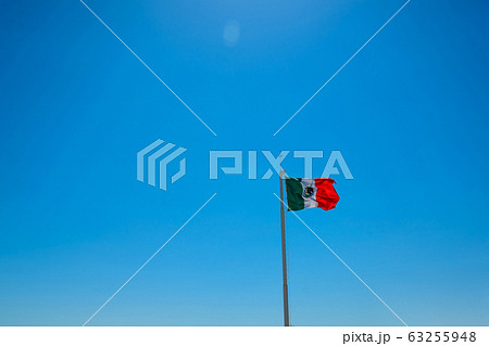 Giant mexican flag flies in the wind in Cancun Giant mexican flag flies in the wind in Cancun 63255948