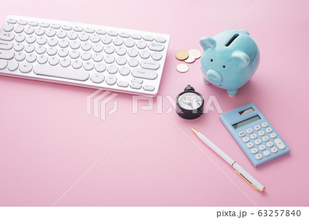 Computer keyboard with piggy bank, calculator and 63257840