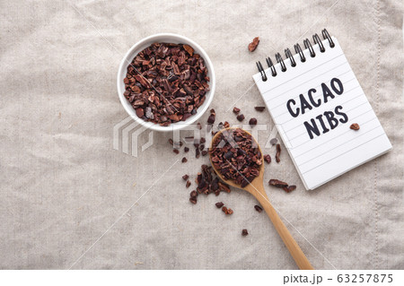 Cacao nibs on table, top view with copy space 63257875