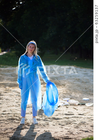 volunteering, charity, cleaning, people and ecology concept, volunteer with garbage bag cleaning are volunteering, charity, cleaning, people and ecology concept, volunteer with garbage bag cleaning are 63259137