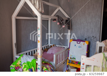 Messy kid's room in daylight.View over messy in Messy kid's room in daylight.View over messy in 63259987