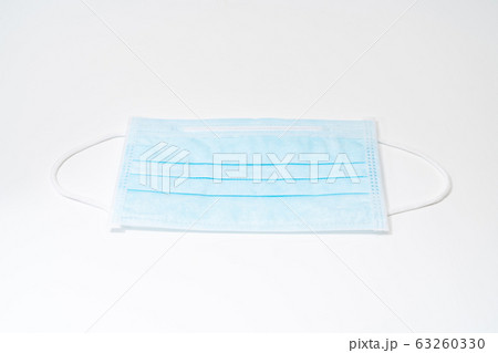 Surgical mask with rubber ear straps. Typical Surgical mask with rubber ear straps. Typical 63260330