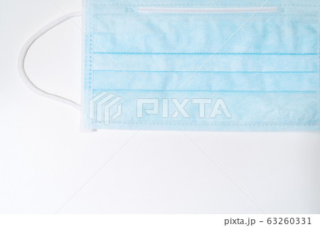 Surgical mask with rubber ear straps. Typical Surgical mask with rubber ear straps. Typical 63260331