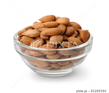 Glass bowl of peeled apricot kernels Glass bowl of peeled apricot kernels 63260594