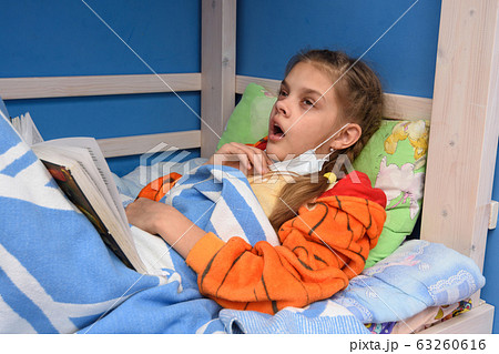 Tired sick girl prepares to once again sneeze 63260616