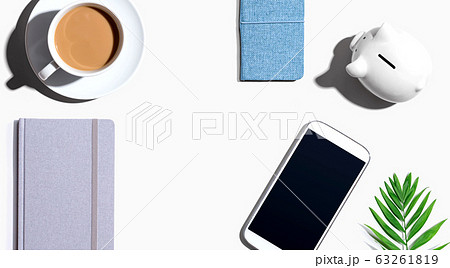 Smartphone with a piggy bank and notebooks Smartphone with a piggy bank and notebooks 63261819