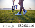 Woman golfer drop a golf ball in the rough area after lost of golf ball out of fairway 63268110