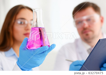 Female technician arms in protective gloves 63270475