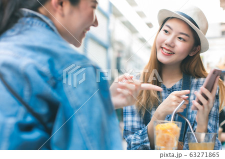 Young Asian female friends taking her vacation and Young Asian female friends taking her vacation and 63271865