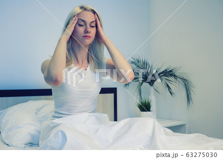 Depressed woman awake in the night, she is Depressed woman awake in the night, she is 63275030