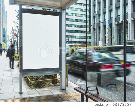 Mock up Banner Blank Poster Media Advertisement at Bus stop with taxi on street 63275557