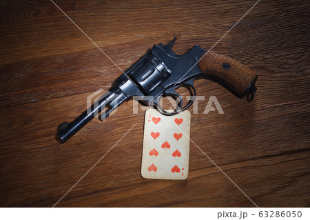 russian roulette - Nine of Hearts plaing card and 63286050