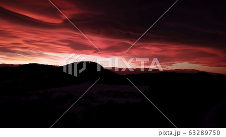 Beautiful dramatic red sunset in winter mountains 63289750