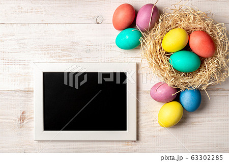 Easter concept, copy space, top view, white wood Easter concept, copy space, top view, white wood 63302285