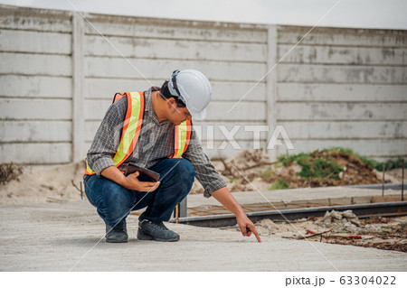 Man construction engineer at construction site Man construction engineer at construction site 63304022
