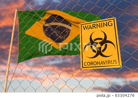Coronavirus warning sign on the fence on the Brazilian flag background. Restricted entry or quarantine in Brazil. Conceptual 3D rendering Coronavirus warning sign on the fence on the Brazilian flag background. Restricted entry or quarantine in Brazil. Conceptual 3D rendering 63304276