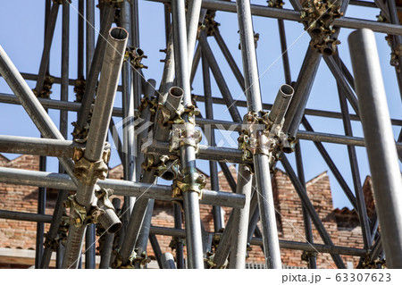 Scaffolding pipe clamp and parts, An important part of building strength to scaffold clamps in used close up on construction site,platforms for stage structure support 63307623