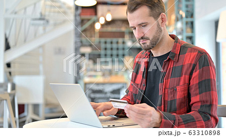 Shopping, Online Payment on Laptop by Beard Young Man Shopping, Online Payment on Laptop by Beard Young Man 63310898