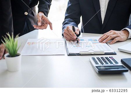 Business team colleagues discussing working Business team colleagues discussing working 63312295