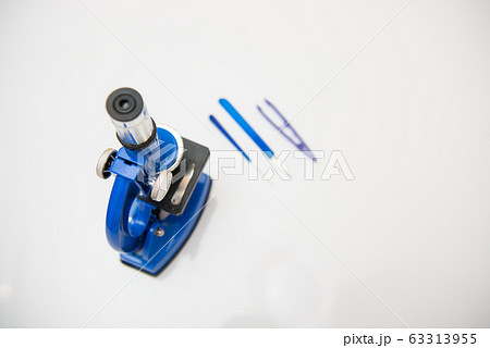 microscope isolated on a white background with research tools microscope isolated on a white background with research tools 63313955