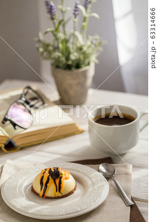 Still life with coffee, cake and a bouquet of Still life with coffee, cake and a bouquet of 63314666