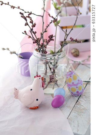 Happy Easter, colored eggs, pussy-willow twigs on the windowsill, spring, holiday decor Happy Easter, colored eggs, pussy-willow twigs on the windowsill, spring, holiday decor 63315727
