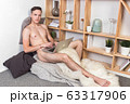 Naked sexy guy works at home with laptop 63317906