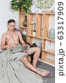 Naked sexy guy works at home with laptop 63317909