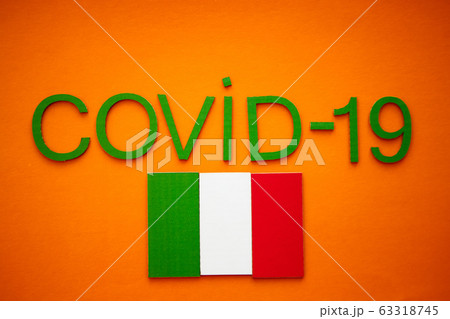Italian Flag And Inscription COVID-19 on orange background. World Health Organization WHO introduced new official name for Coronavirus disease named COVID-19 Italian Flag And Inscription COVID-19 on orange background. World Health Organization WHO introduced new official name for Coronavirus disease named COVID-19 63318745