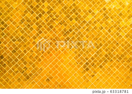 Closeup view of many gold shiny squares surface 63318781