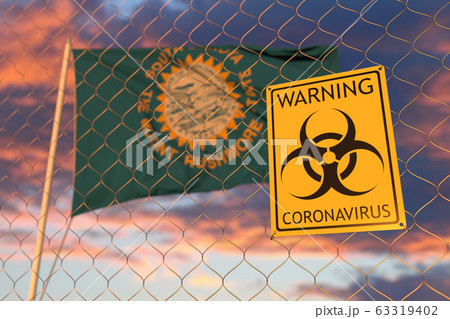 Biohazard coronavirus sign against flying flag of South Dakota. Quarantine related 3D rendering 63319402
