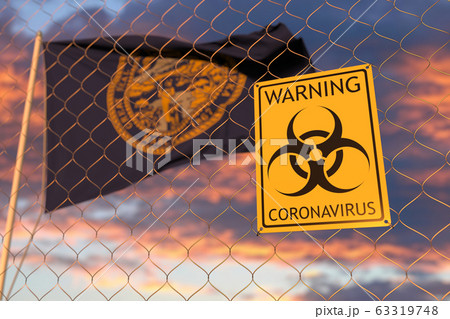 Coronavirus warning sign on the fence against flag of Nebraska. Quarantine related 3D rendering 63319748