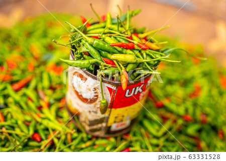 Red and green chili pepper in tin can, local organic market 63331528