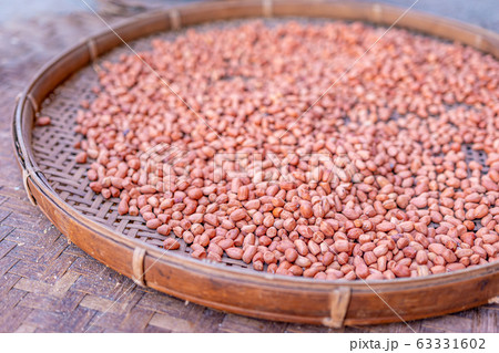 Shelled peanuts in a threshing basket, local market Shelled peanuts in a threshing basket, local market 63331602