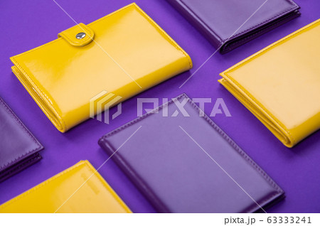 flat lay handmade purple and yellow purse on a matte table flat lay handmade purple and yellow purse on a matte table 63333241