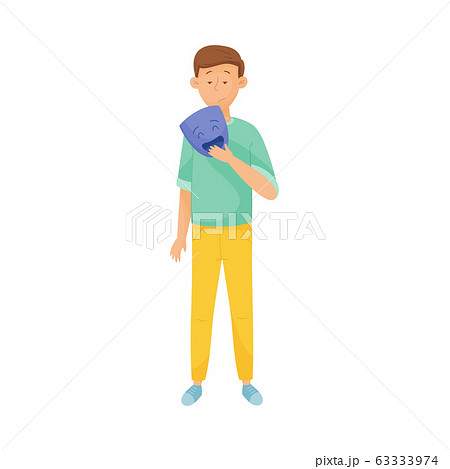 Young Sad Man Standing and Holding Mask with Happy Emotion in His Hands Vector Illustration 63333974