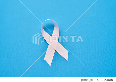 White ribbon isolated on blue background White ribbon isolated on blue background 63335080
